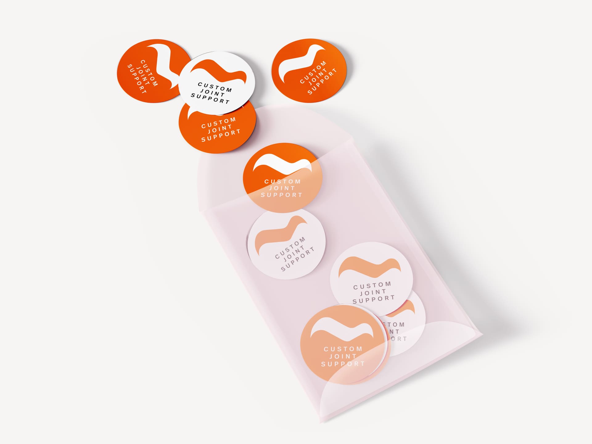 Etichette adesive arancioni e bianche disposte su una superficie, con scritta Custom Joint Support.